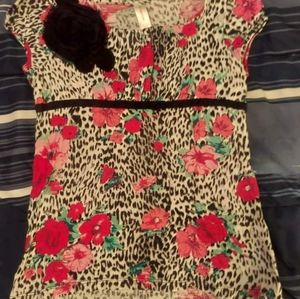 Leapord print T shirt with floral pattern and a black flower